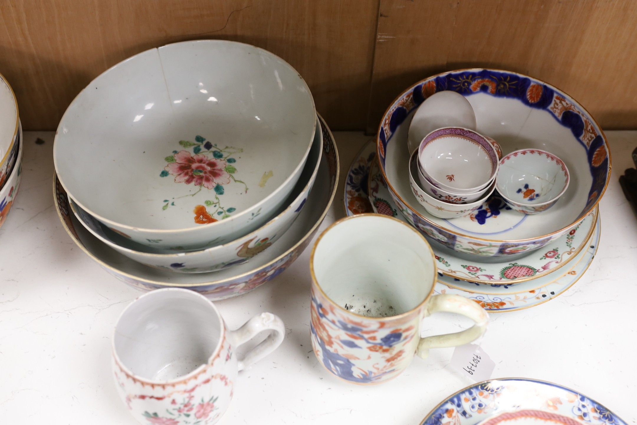 A large selection of 18th century Chinese export porcelain bowls, plates and mugs a/f